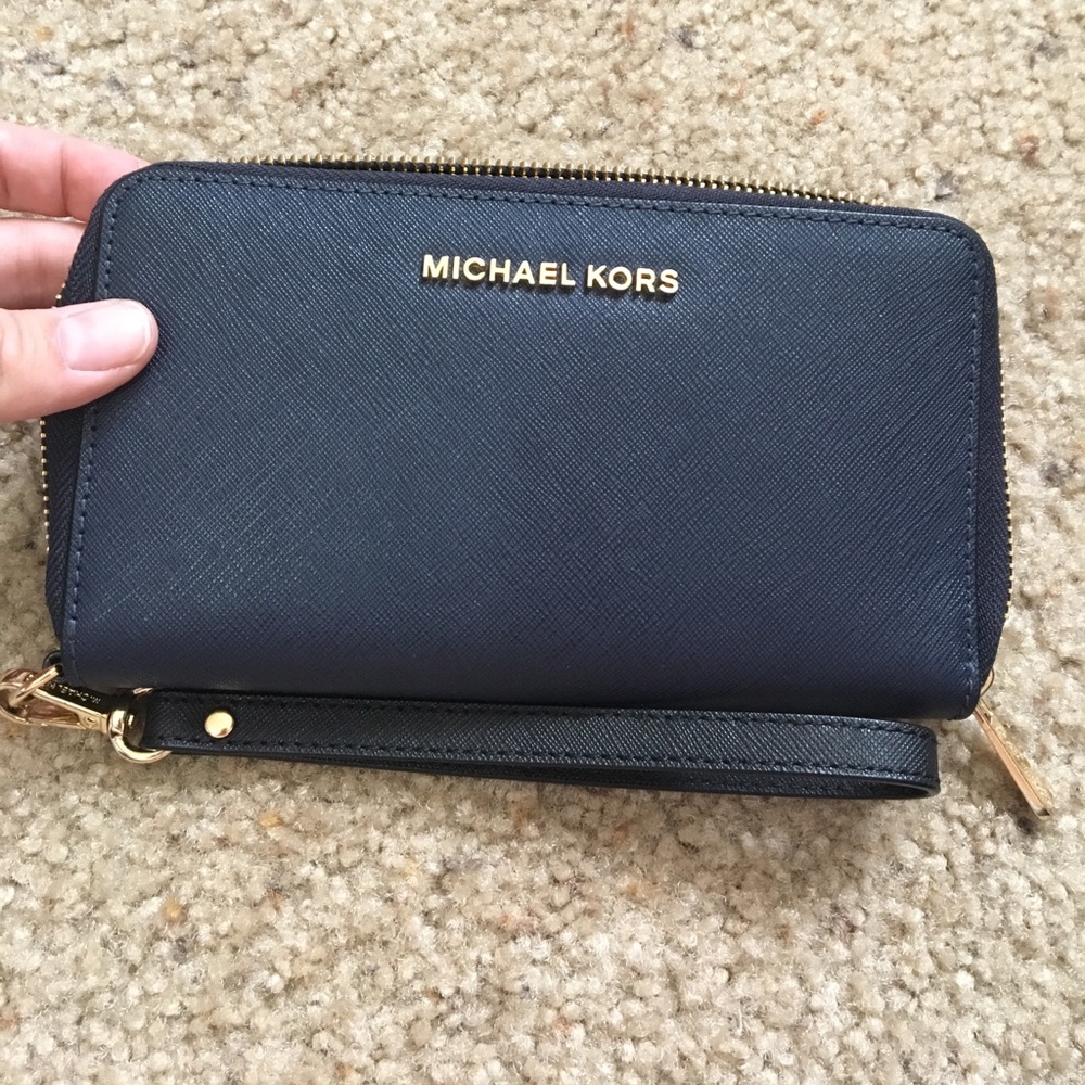 Michael Kors wristlet with phone pocket.