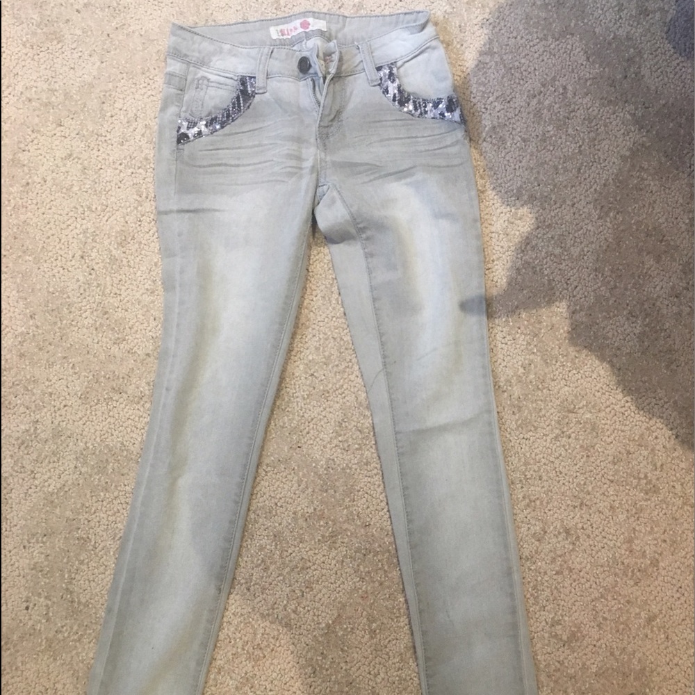 gray skinny jeans with glittery cheetah pockets