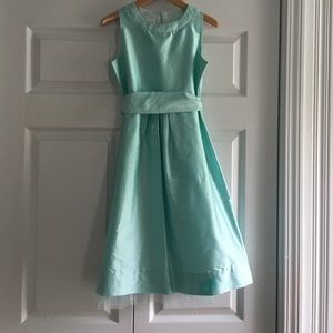 Sweet girl's light turquoise silk dress.