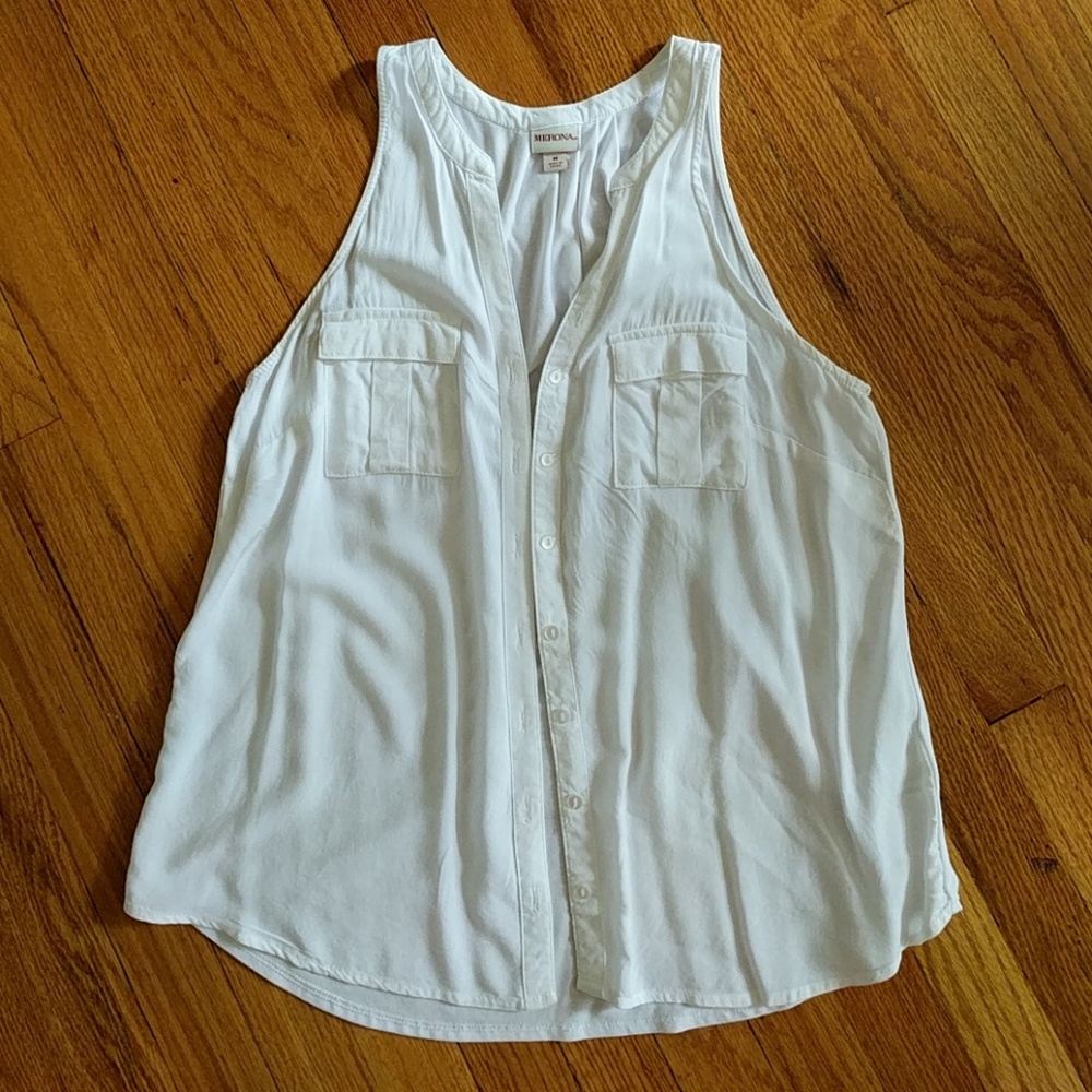 Sleeveless white button-down blouse