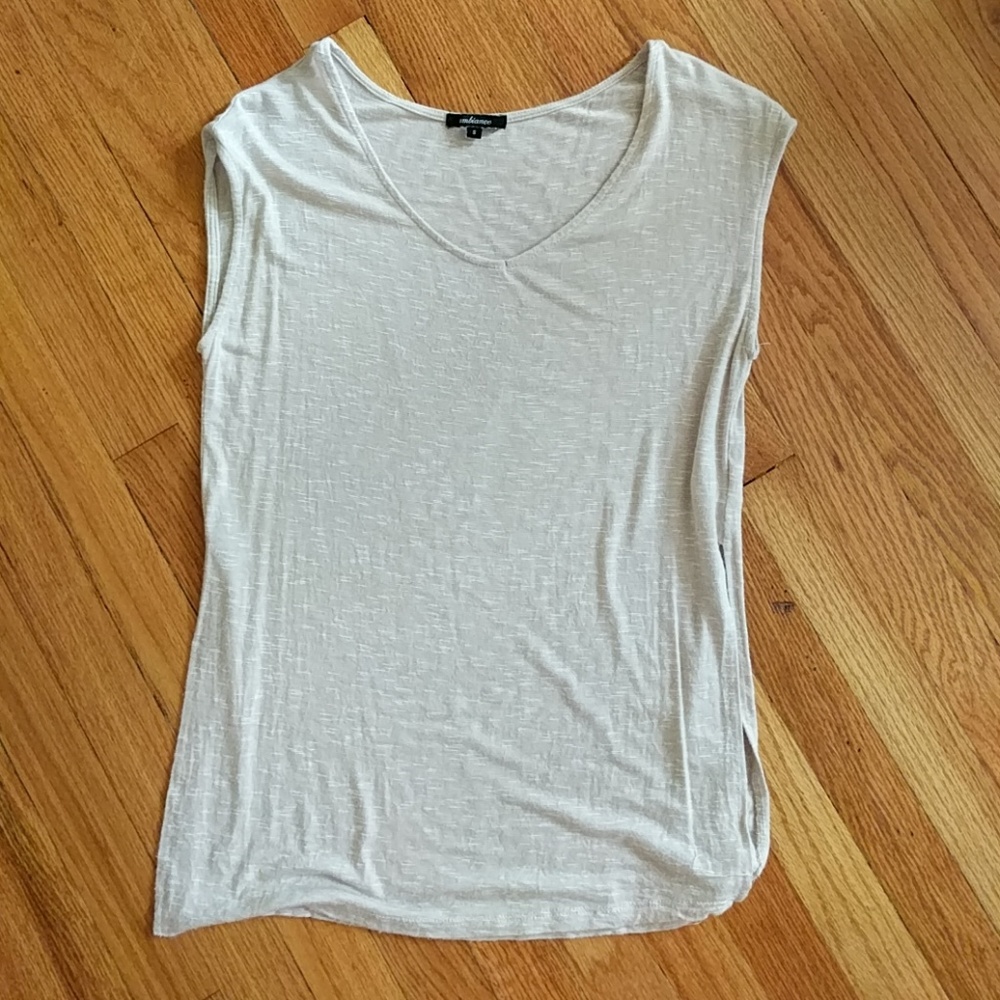 Sleeveless cream tunic top with side slits