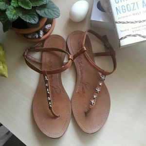 Light brown thong sandals with silver star gems