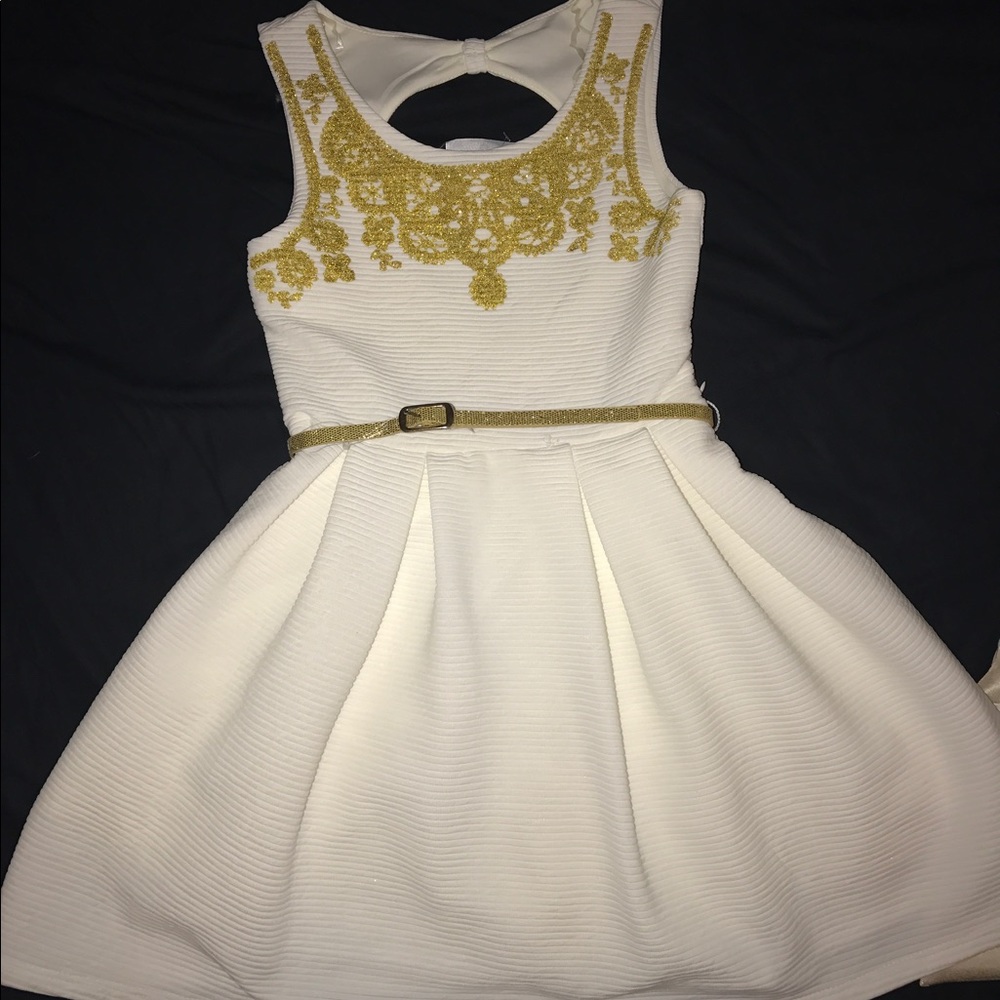 White dress with gold embellishments