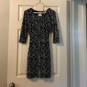 A black and silver, sparkly, tight fit dress.