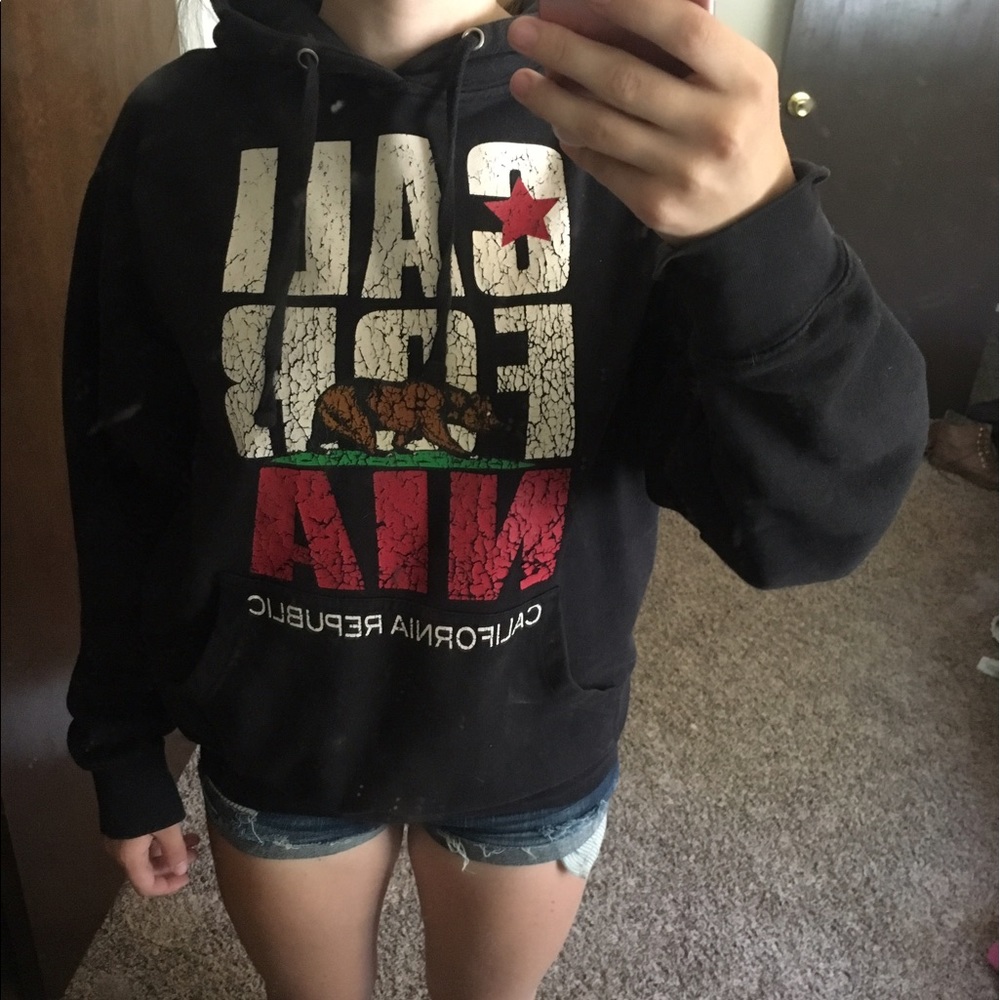 Black hoodie sweatshirt with CA letters and bear.