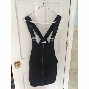 black overall dress with front zipper