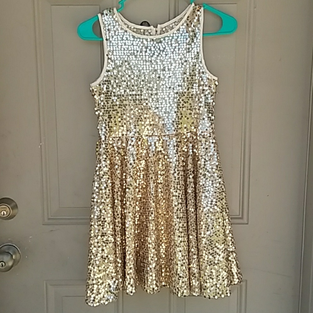 A gold sequin dress