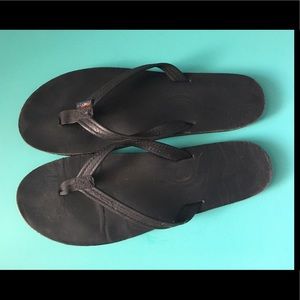 Black rainbow flip flops
