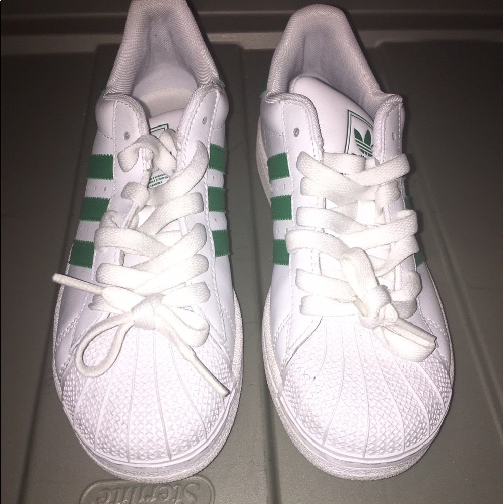 Green and white Shell toe Adidas
