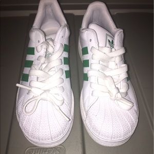 Green and white Shell toe Adidas