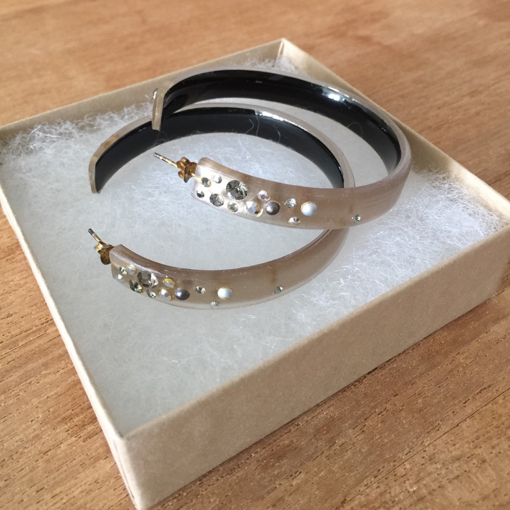 Light tan hoop earrings with sparkles