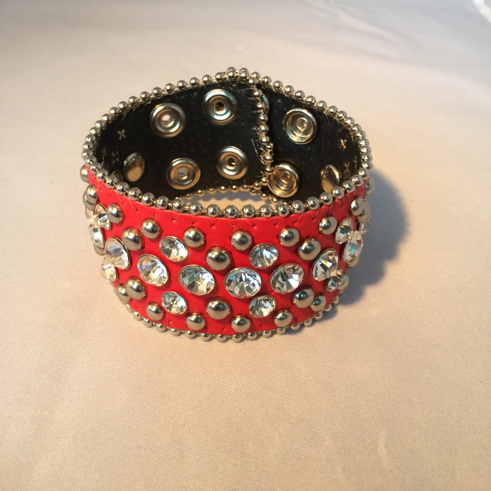 Red leather and crystal studded cuff bracelet.