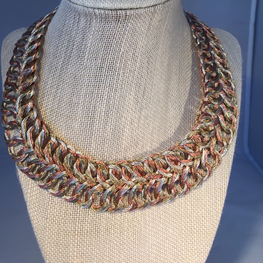 Hand woven collar style necklace.