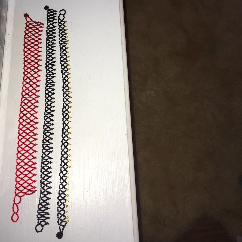 Red, black, black and gold chokers