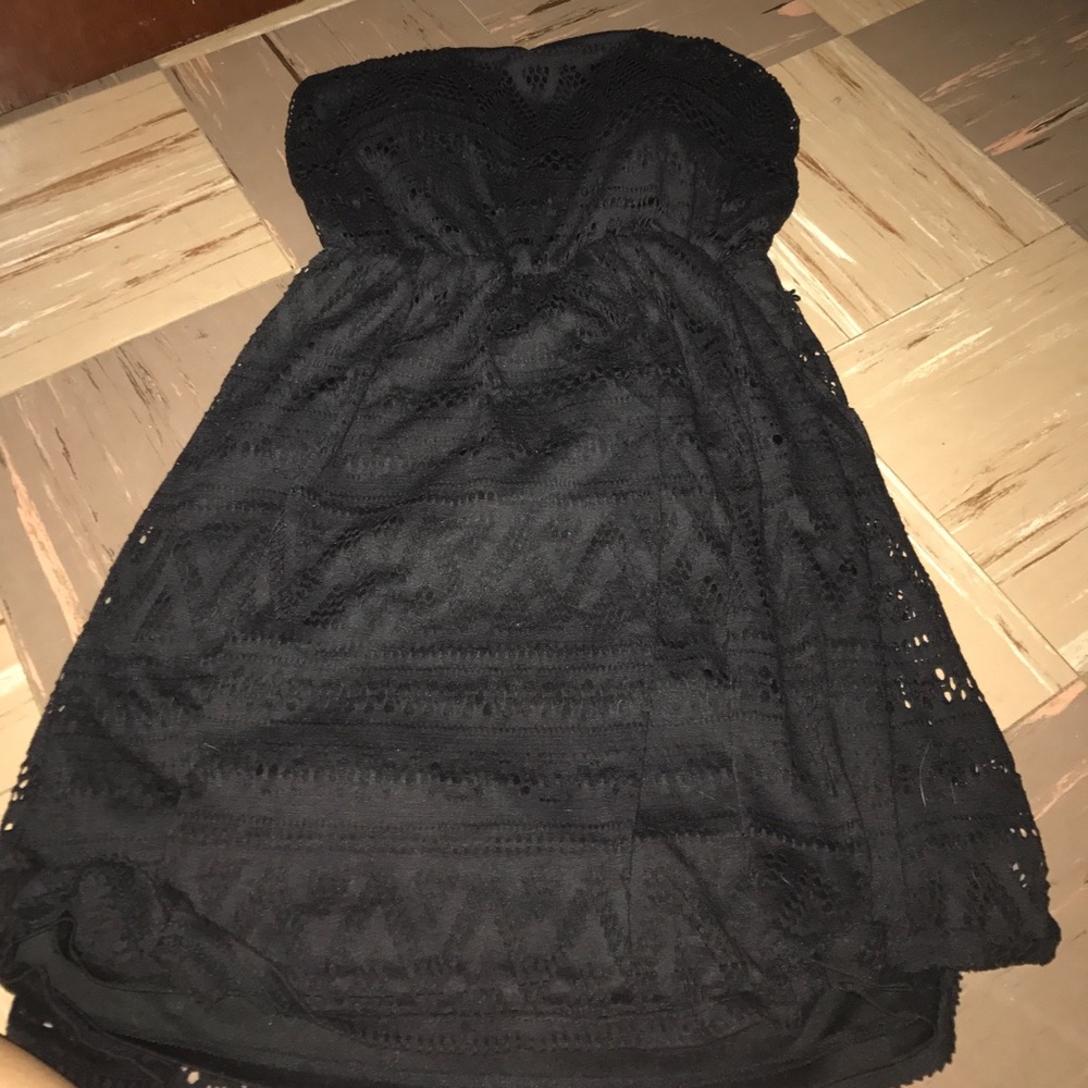 An adorable sleeveless black summer dress