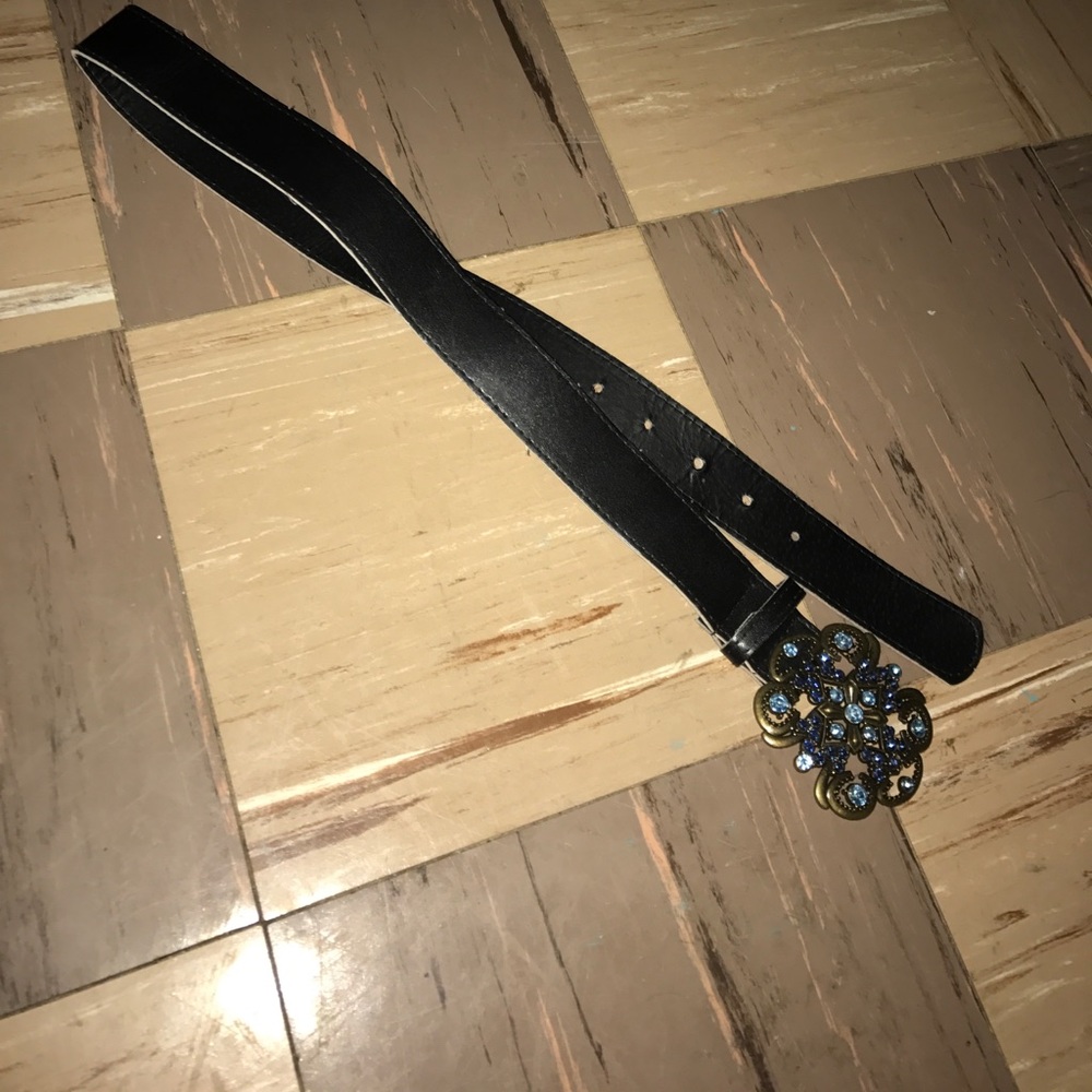 A black belt with blue rhinestones