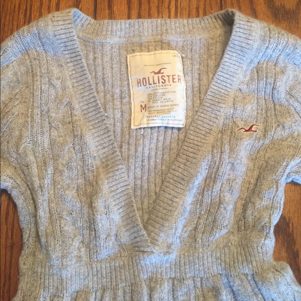 I'm selling a grey sweater.
