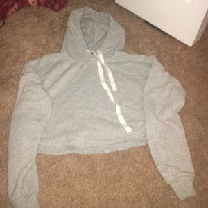 A grey crop top hoodie