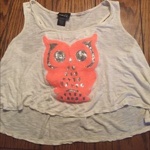 I'm selling a white shirt with a coral colored owl