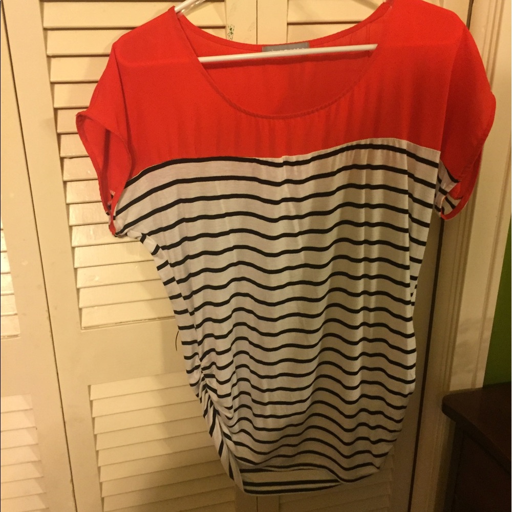 Orange top with white and black stripes