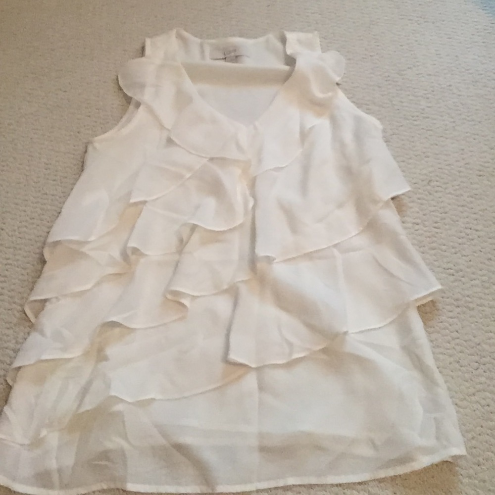 White ruffled blouse