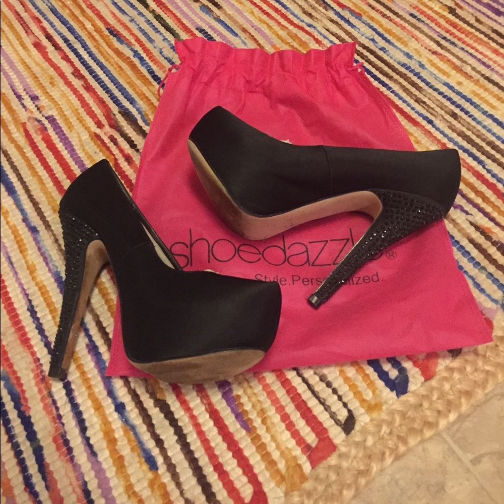 Black satin almond toe pumps
