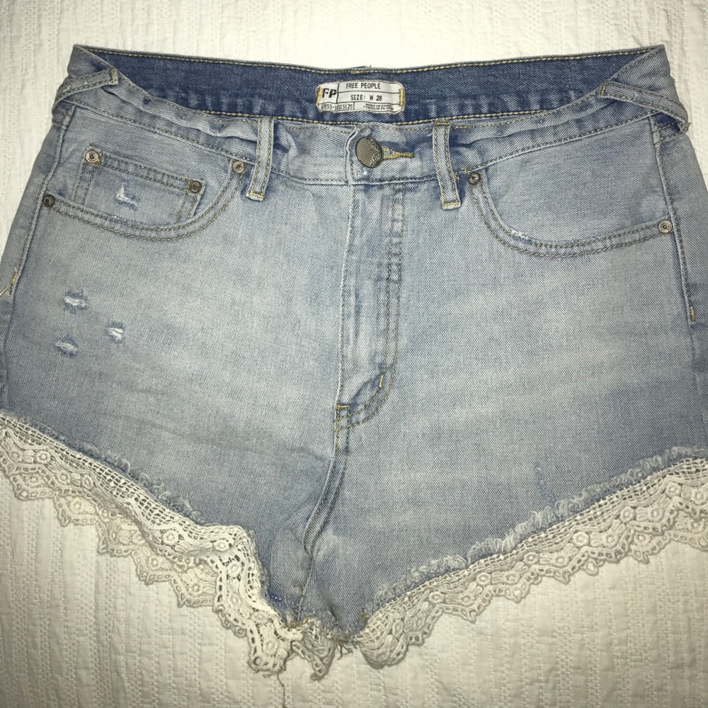 Free People light wash jean shorts with lace trim