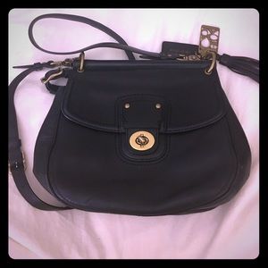 Black leather coach saddle bag