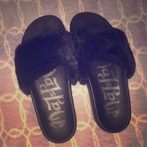 New pair of black slippers