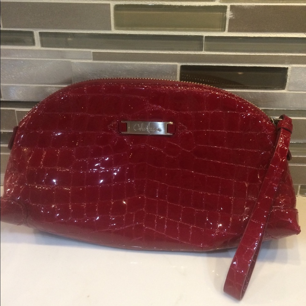 Cole Haan red snakeskin patent clutch/wristlet
