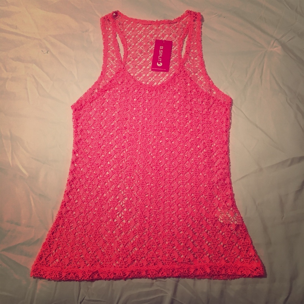 New with tags. Color Pink Tank.