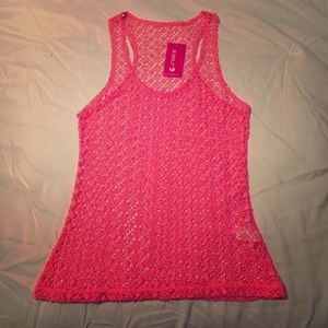 New with tags. Color Pink Tank.