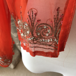 Sheer Orange tie front blouse with bling!