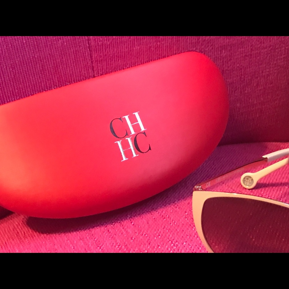 Carolina Herrera sunglasses.