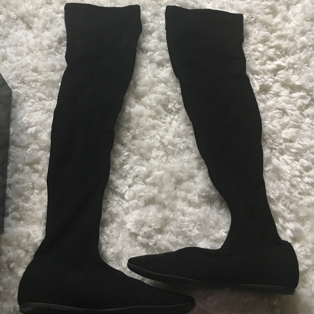 Tall knee length boot with flat heel
