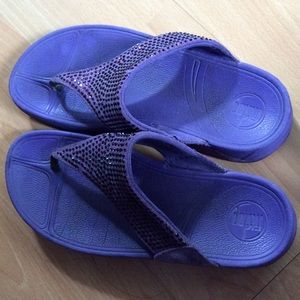 Purple Fitflops with sparkling accents.