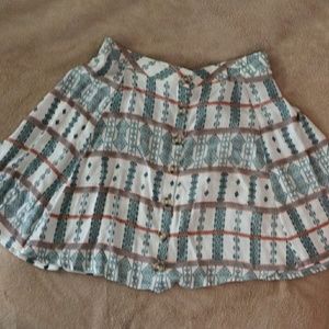 High-waisted short pleated skirt