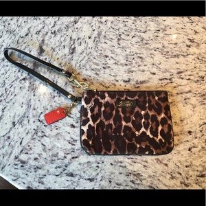 Never used, authentic leopard print Coach wristlet