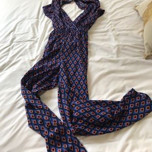 Blue v neck and open back romper