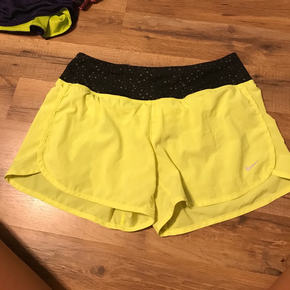 Neon yellow Nike running shorts