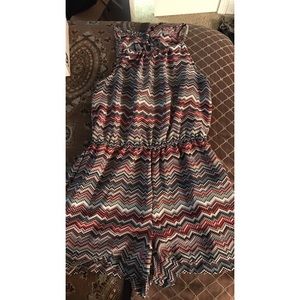 Romper with opening in back.