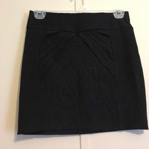 Black mini skirt with subtle snake skin pattern