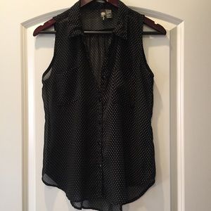 Black polka dot sleeveless blouse. Shear