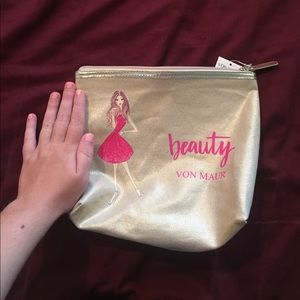 gold makeup bag