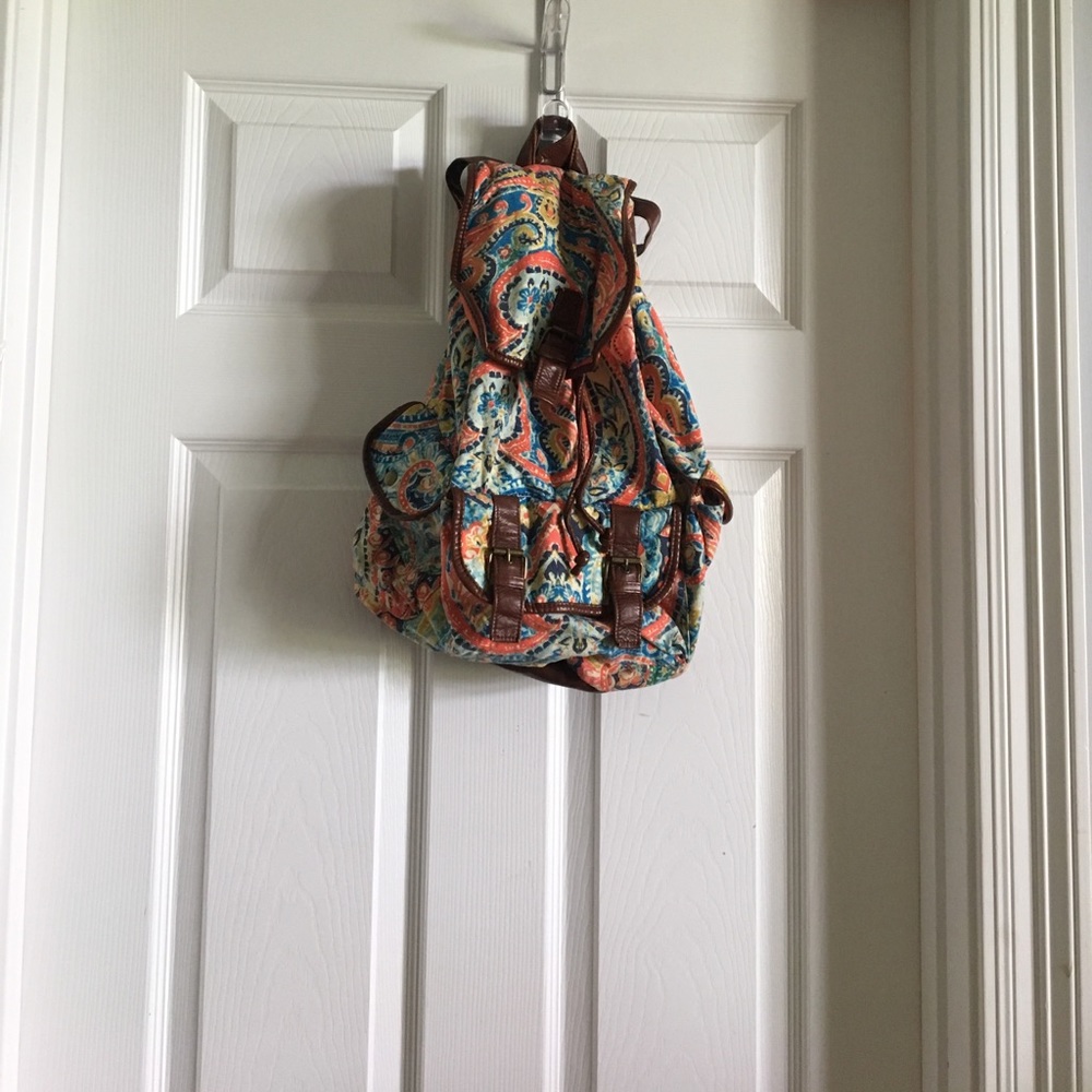 colorful backpack with brown leather straps