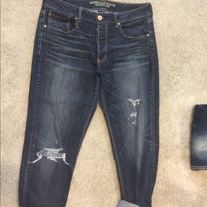 tomgirl fit dark wash button fly and distressed