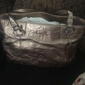 Metallic gold coach purse