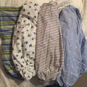 Four nautical crib sheets