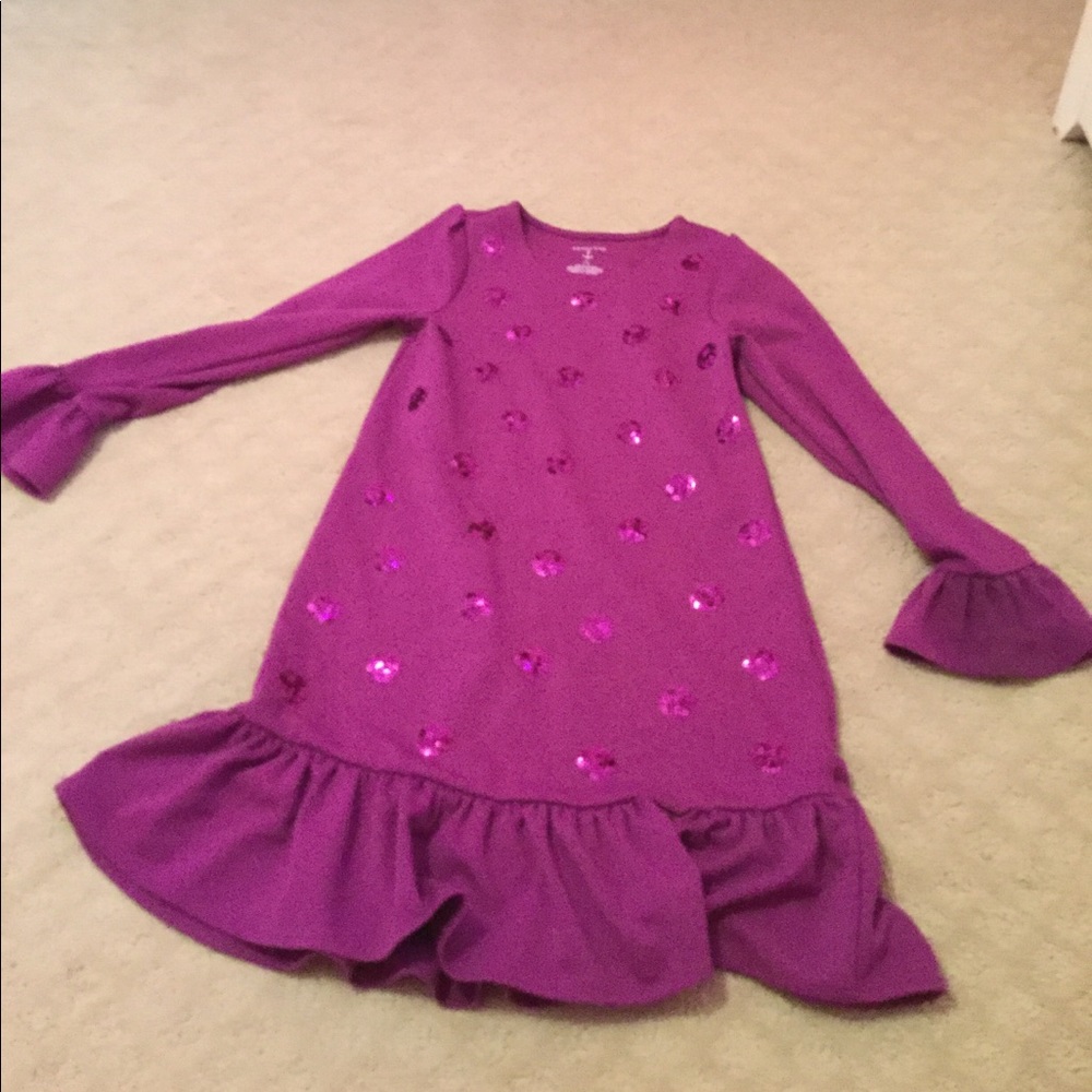 A purple sparkly dotted dress
