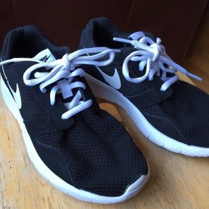 Nike youth tennis shoes  black shoes, white sole